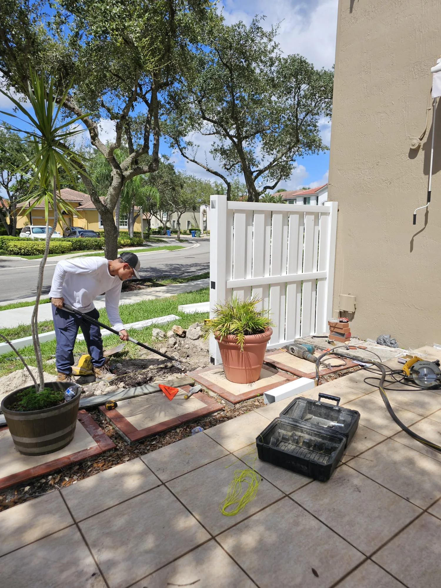 Finishing work on a new privacy fence
