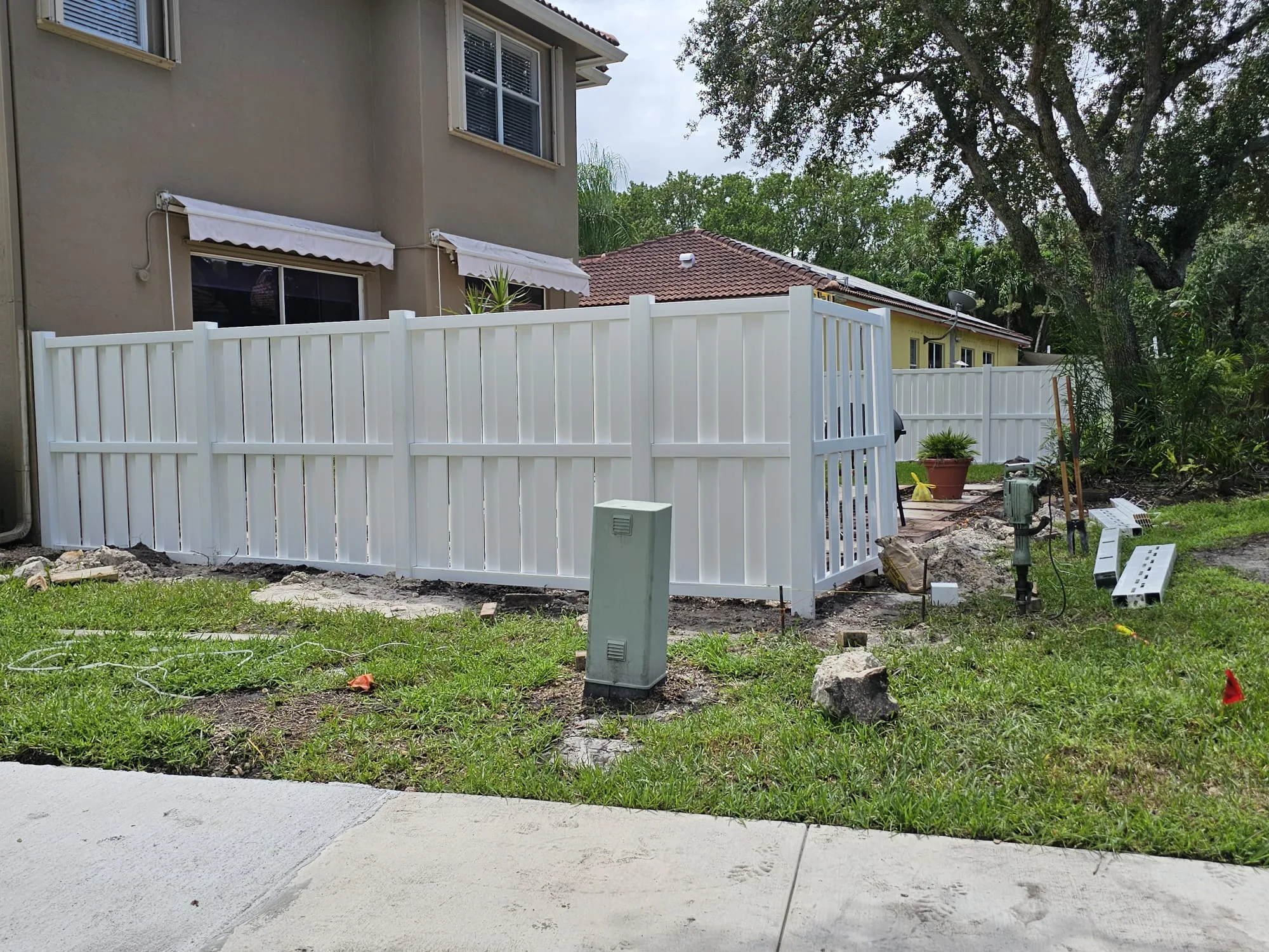 Finished white privacy fence around the property