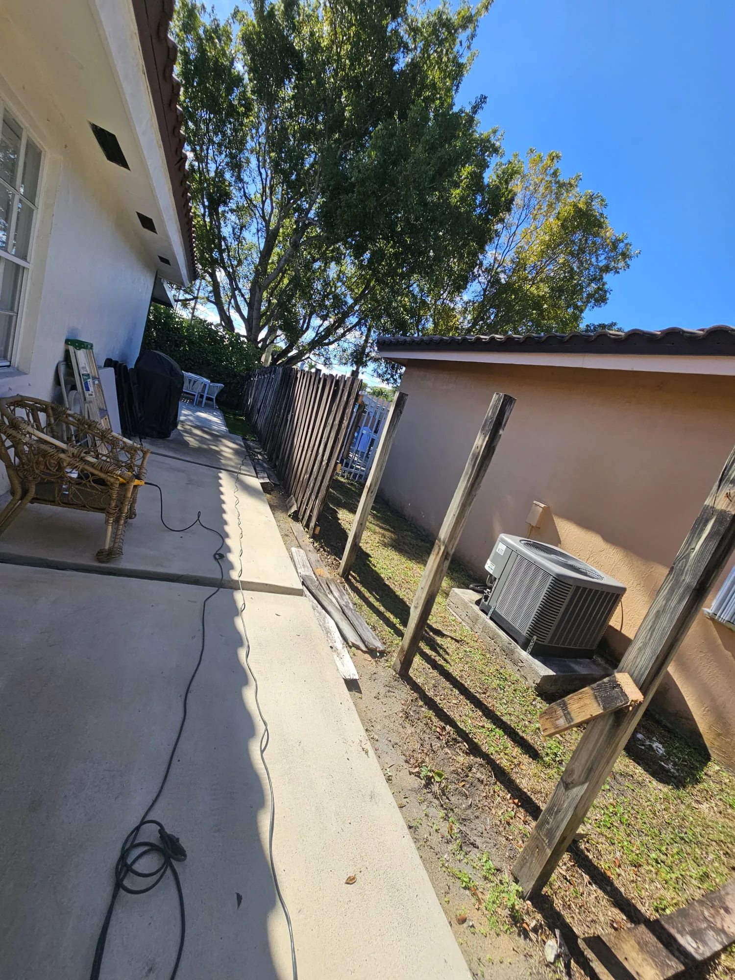 Fence posts and property line before work