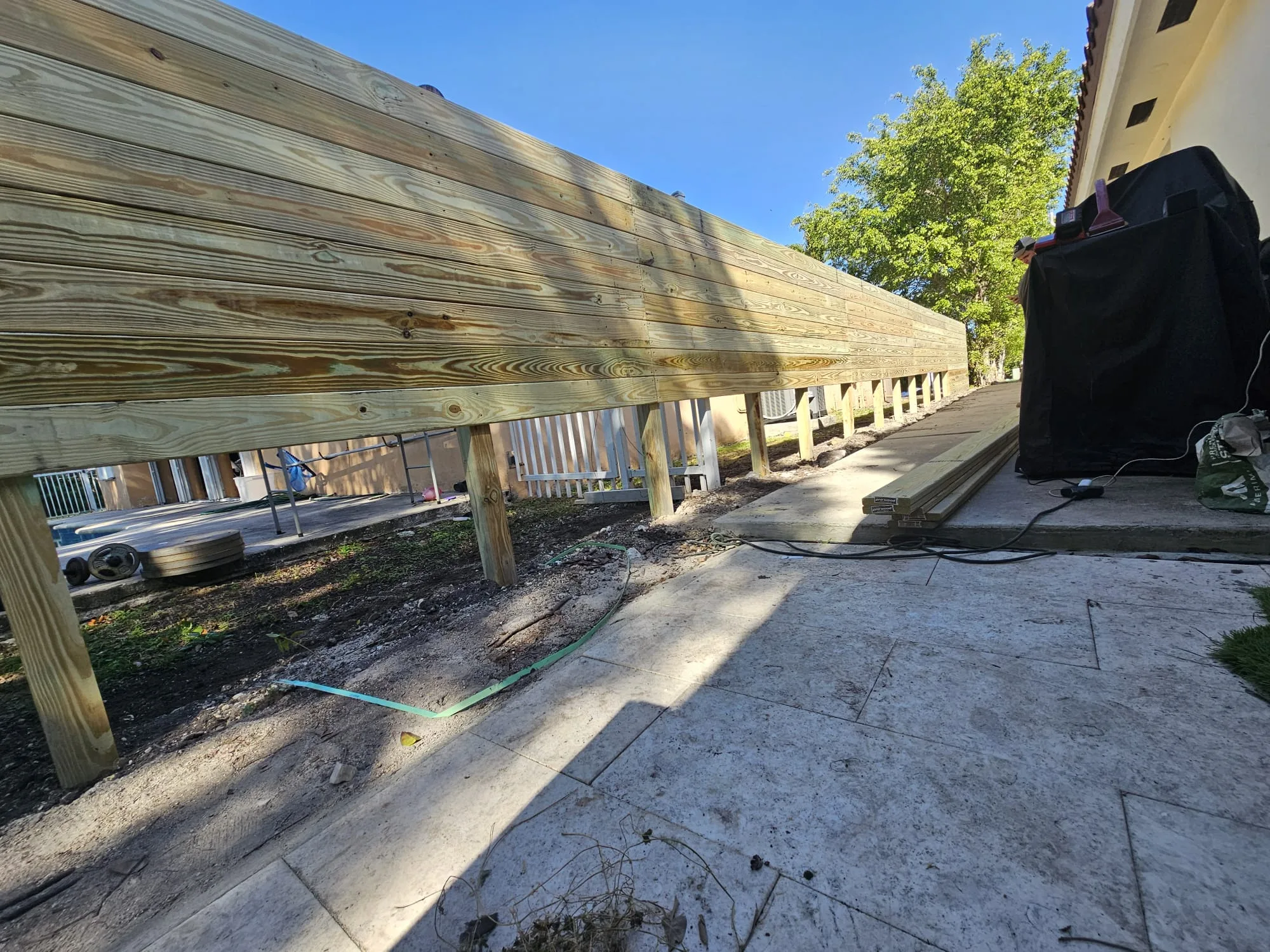 Wood fence construction in progress
