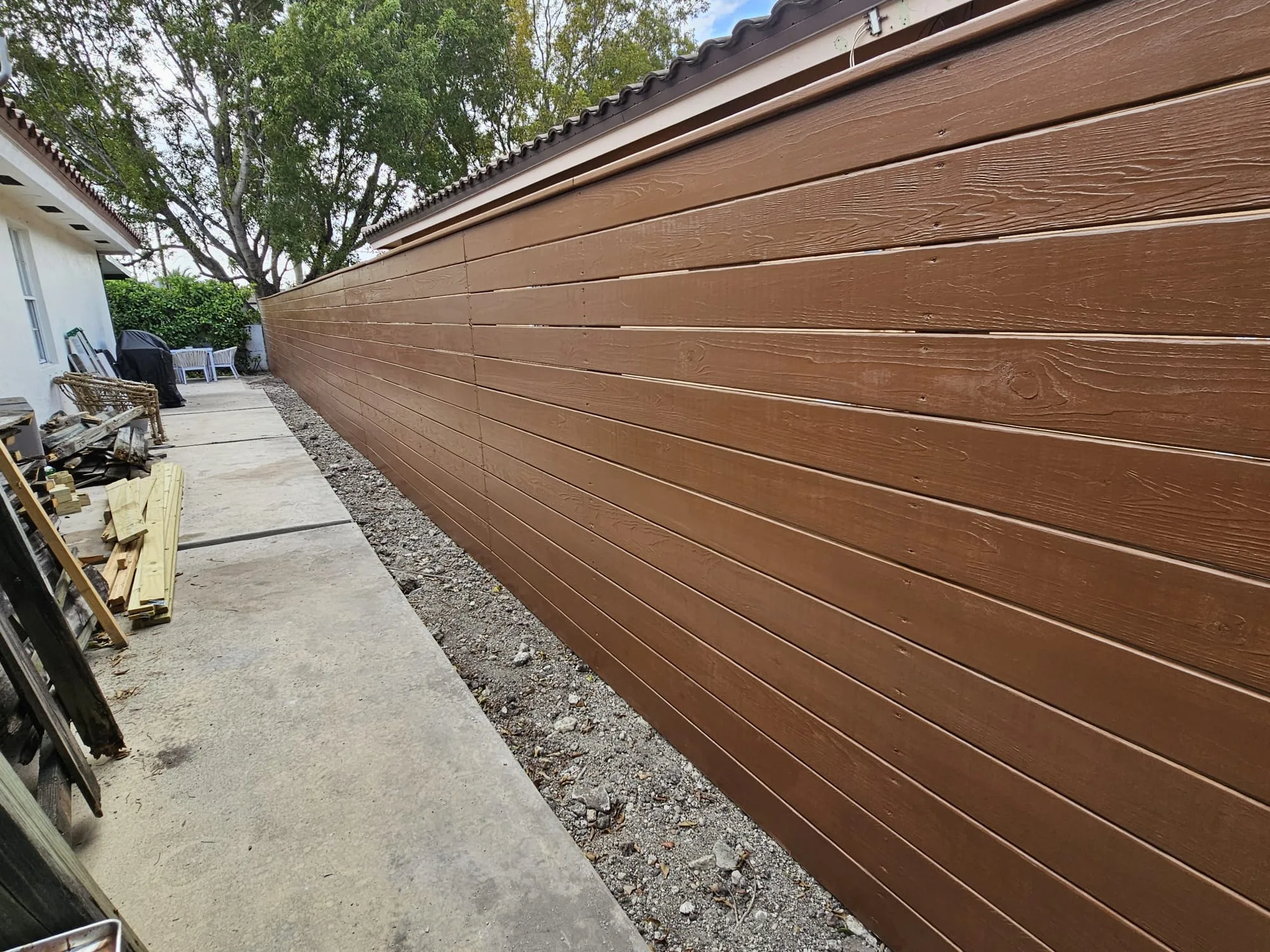 Finished wood privacy fence after the rebuild